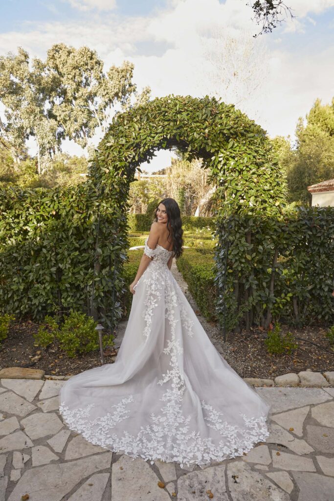 Blush boho lace A-Line wedding dress with flower detail and bardot sleeves