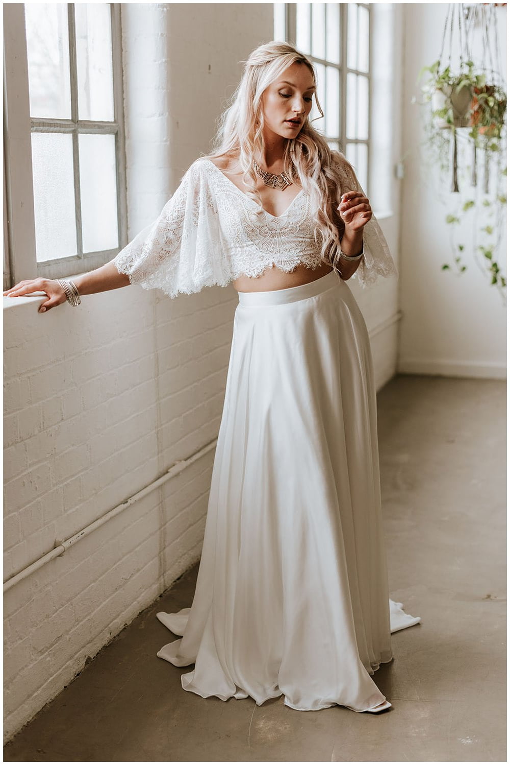 Photograph of the Della Topper and Maya Skirt by Shikoba Bride, available at Bys Vyken Bridal if you are wedding dress shopping in Bristol