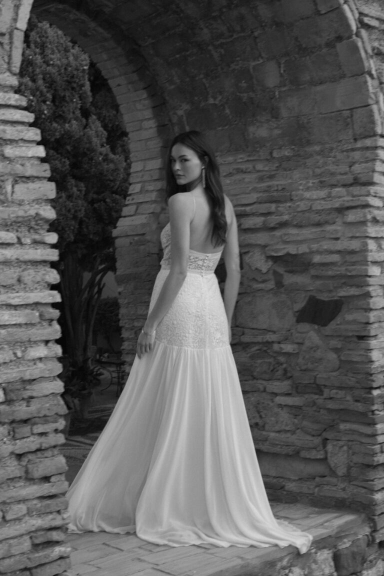 Boho spaghetti strap wedding dress with cutout and soft flowing skirt