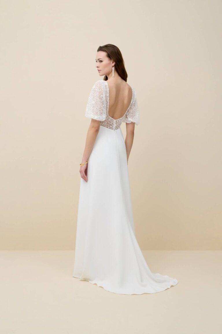 Simple, elegant, floral lace boho wedding dress with detachable sleeves.