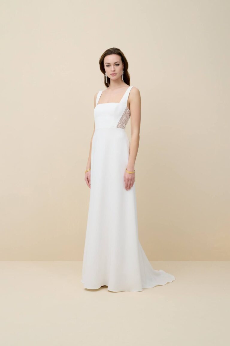 Simple, elegant, floral lace boho wedding dress with detachable sleeves.
