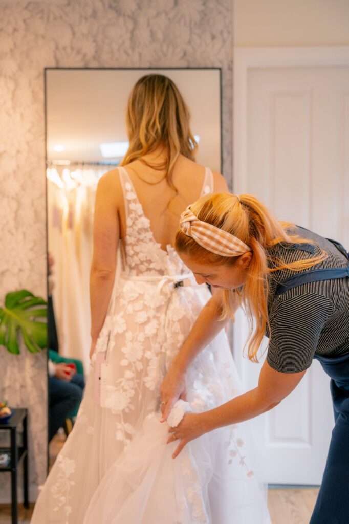 Shopping for a wedding gown at Bys Vyken Bridal an independent bridal shop in Bristol by Just James Wedding Photography