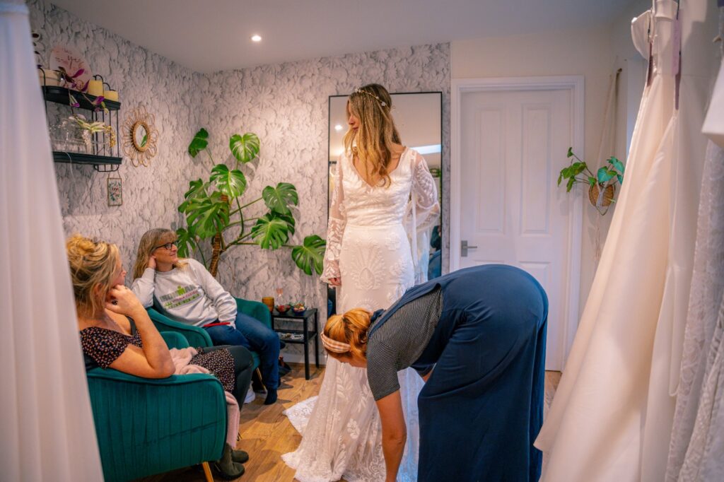 Shopping for a wedding gown at Bys Vyken Bridal an independent bridal shop in Bristol by Just James Wedding Photography