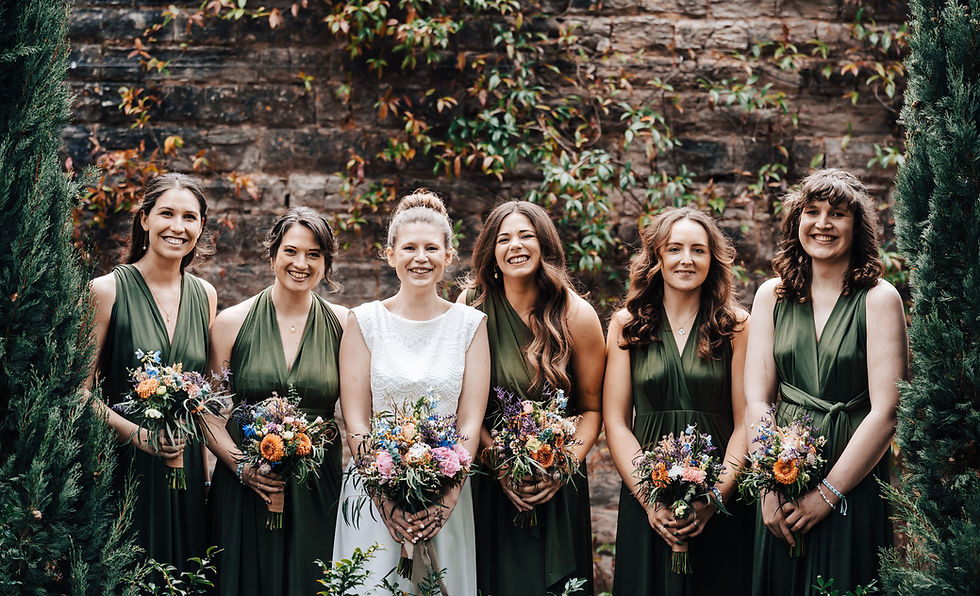 Photograph of a bride and her bridal party showing off their wedding hair styles
