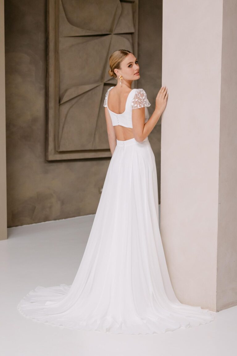 Embroidered tulle, crepe and chiffon wedding dress with cutout detail