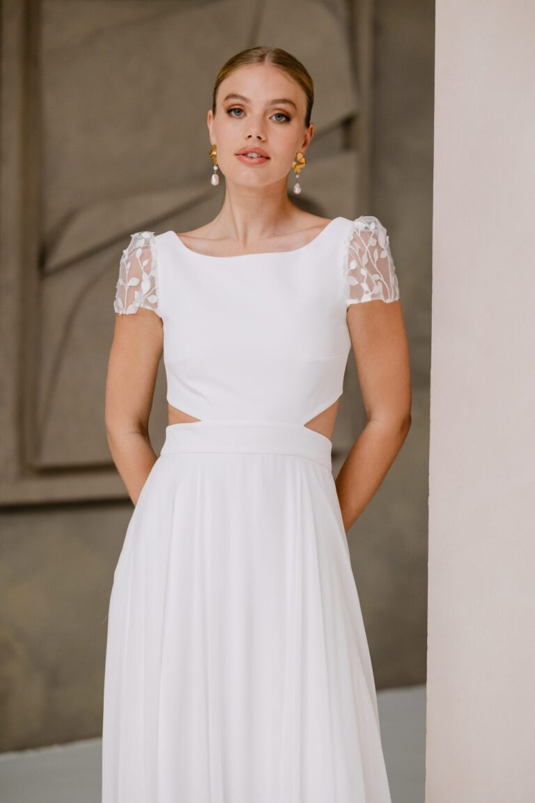 Embroidered tulle, crepe and chiffon wedding dress with cutout detail