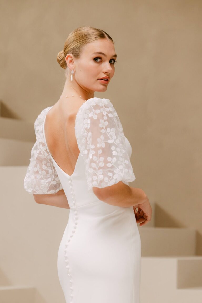 Crepe wedding dress with detachable sleeves and matching cape